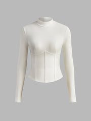 White fitted top with long sleeves and corset details