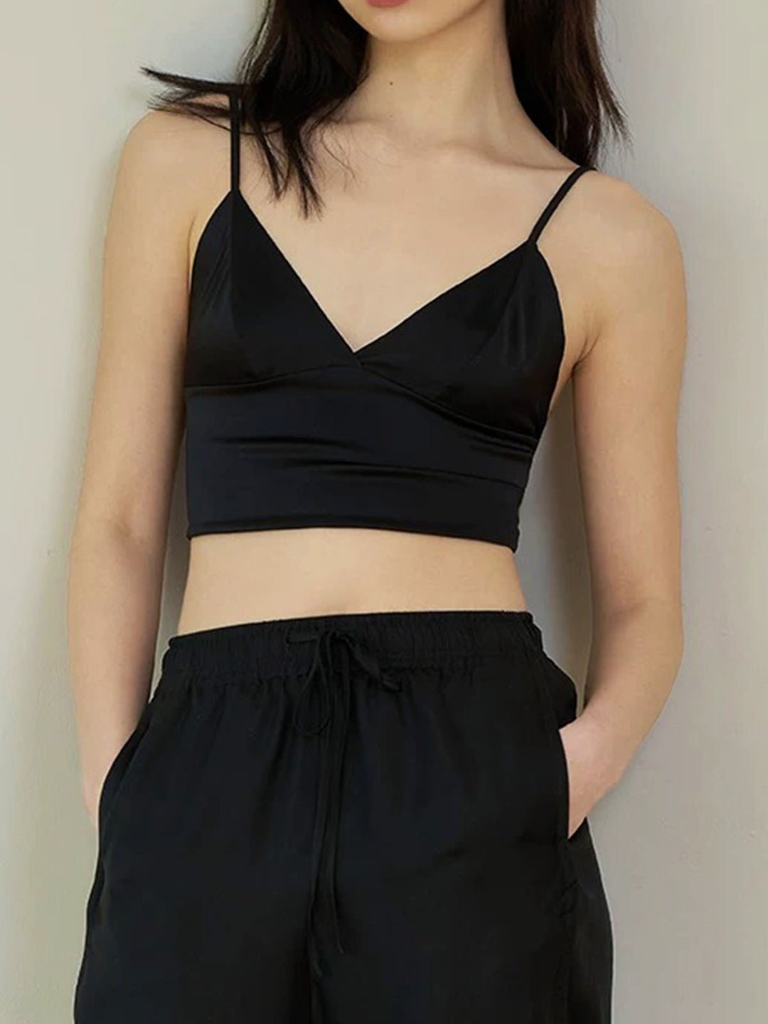 Black satin top with thin straps and V-neck