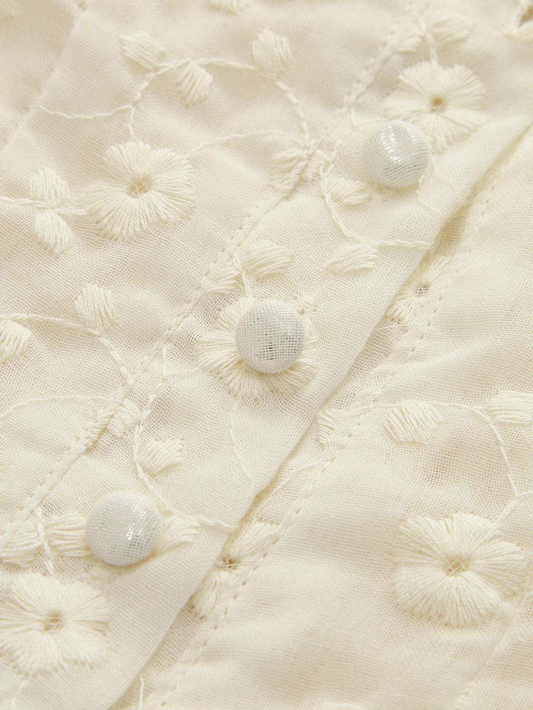 Cream peplum top with floral embroidery