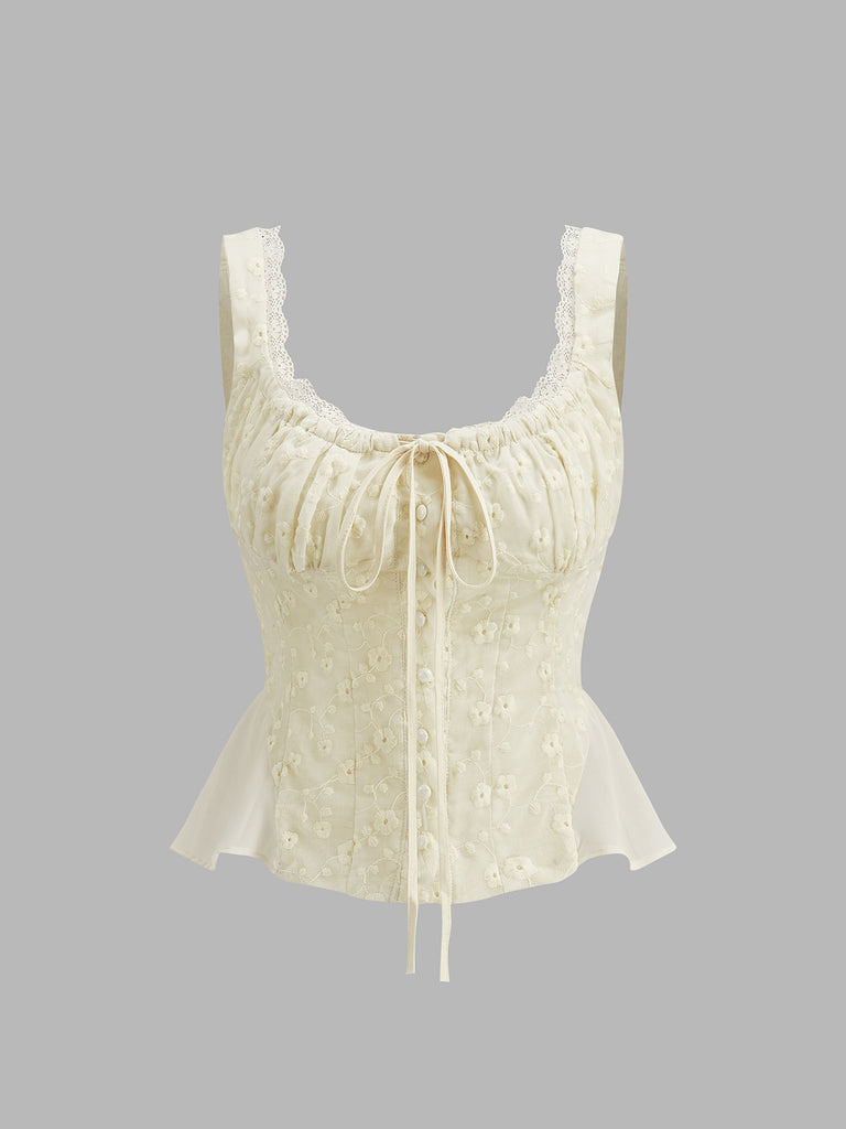 Cream peplum top with floral embroidery