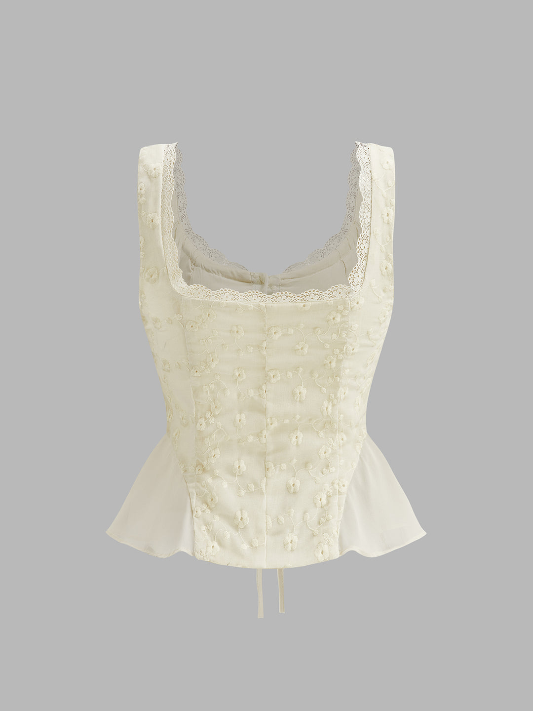 Cream peplum top with floral embroidery
