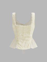 Cream peplum top with floral embroidery