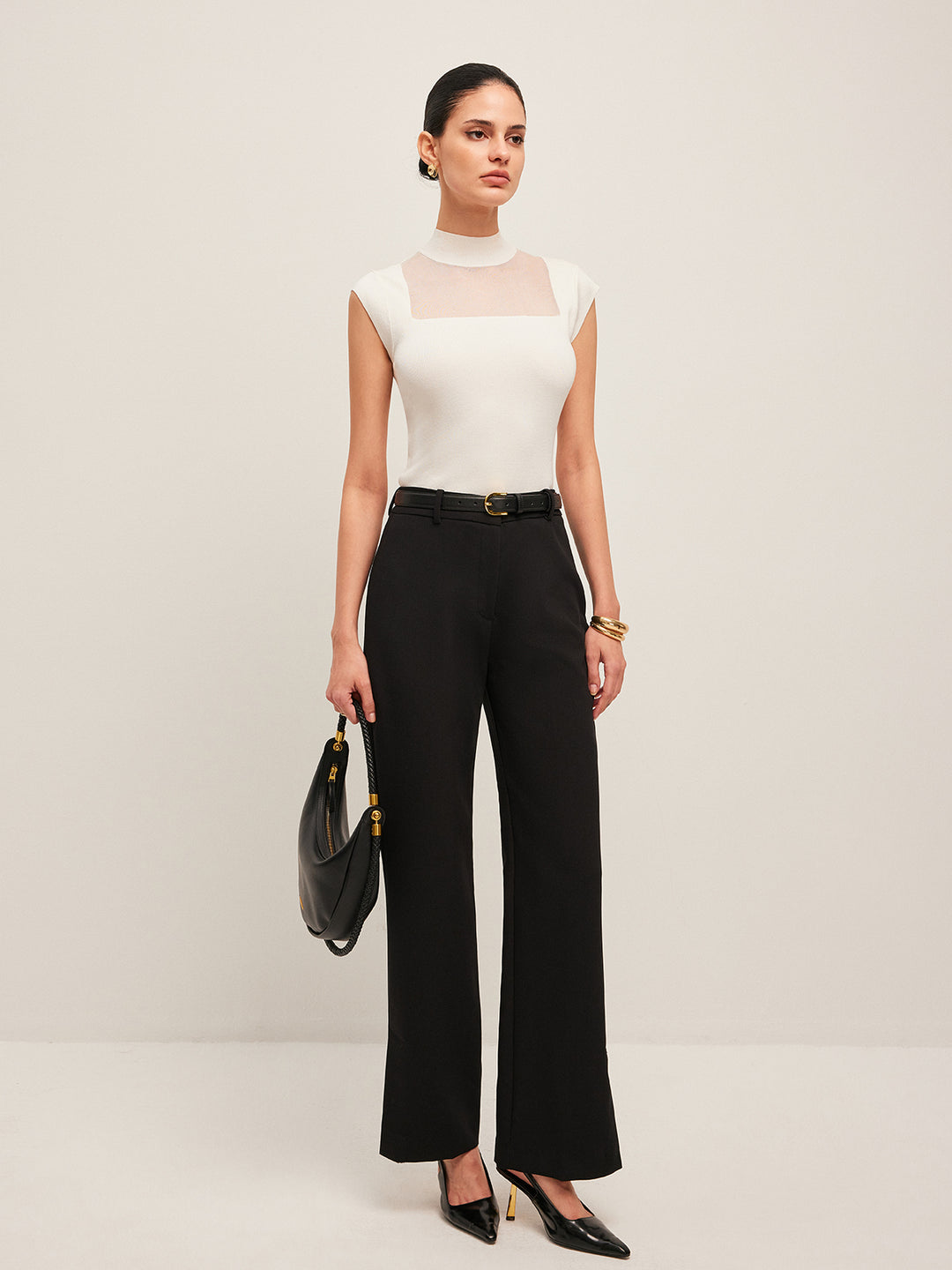 Sleeveless top with mesh details and high neck