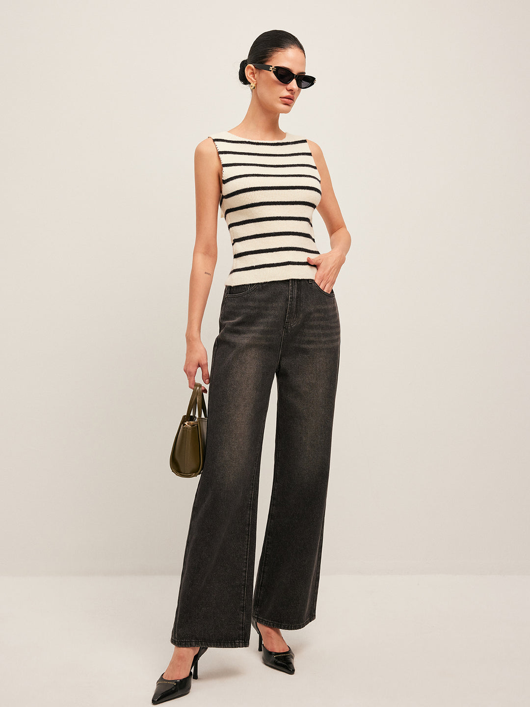 Sleeveless black and white striped knit top