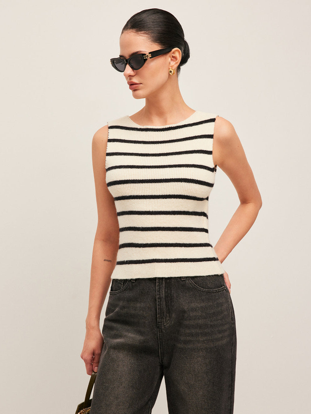 Sleeveless black and white striped knit top