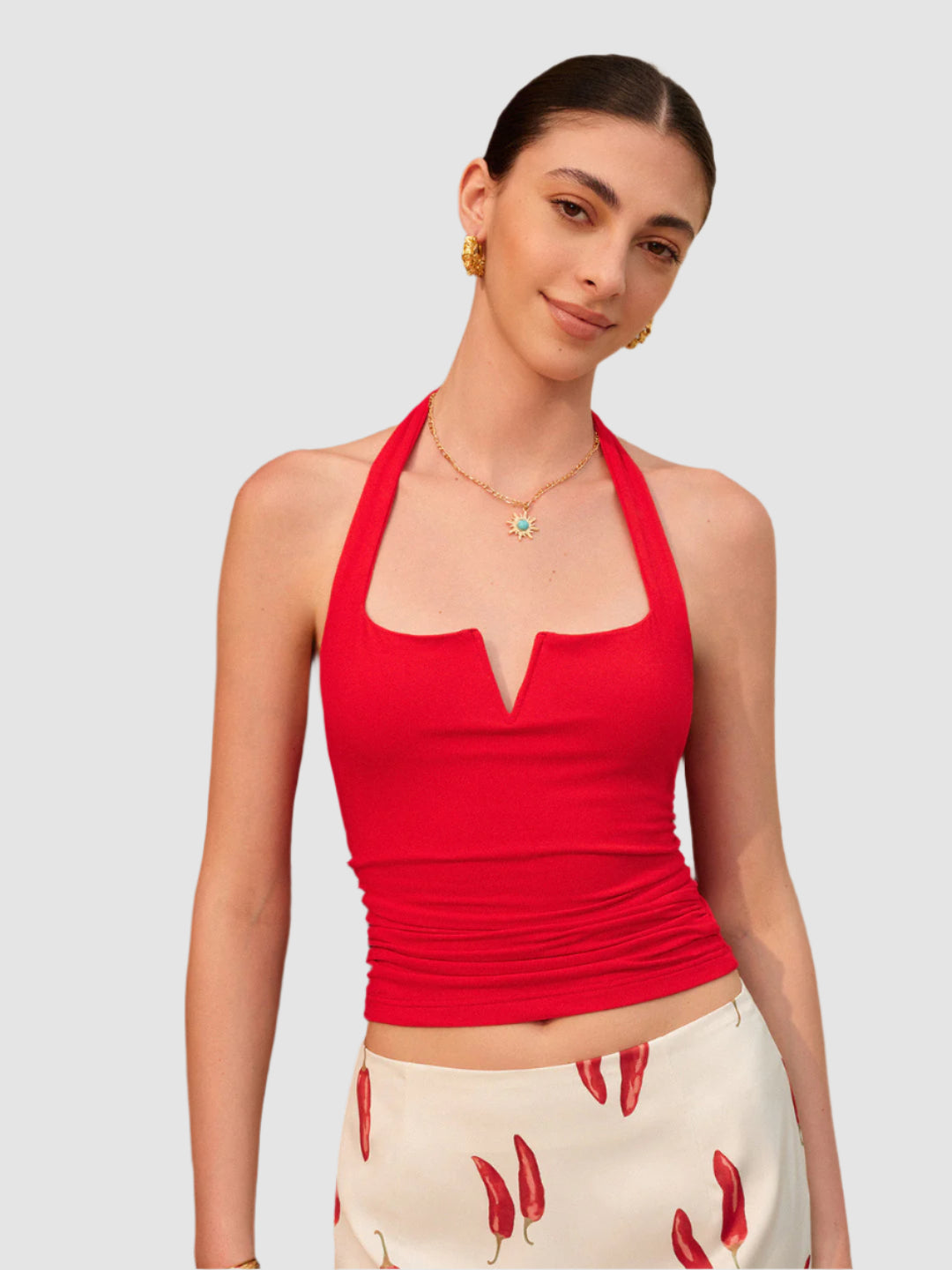 Red V-neck backless top with pleated waist