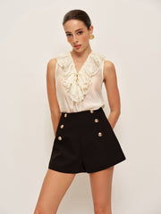 Black shorts with decorative buttons