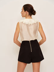 Black shorts with decorative buttons