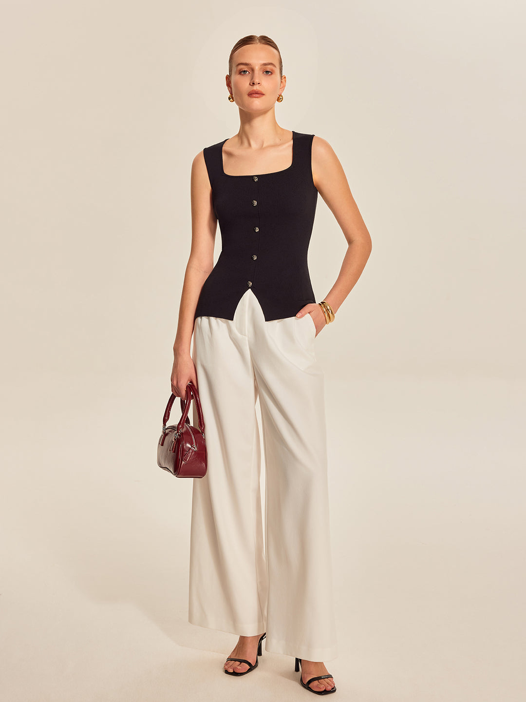 Black ribbed sleeveless top with buttons