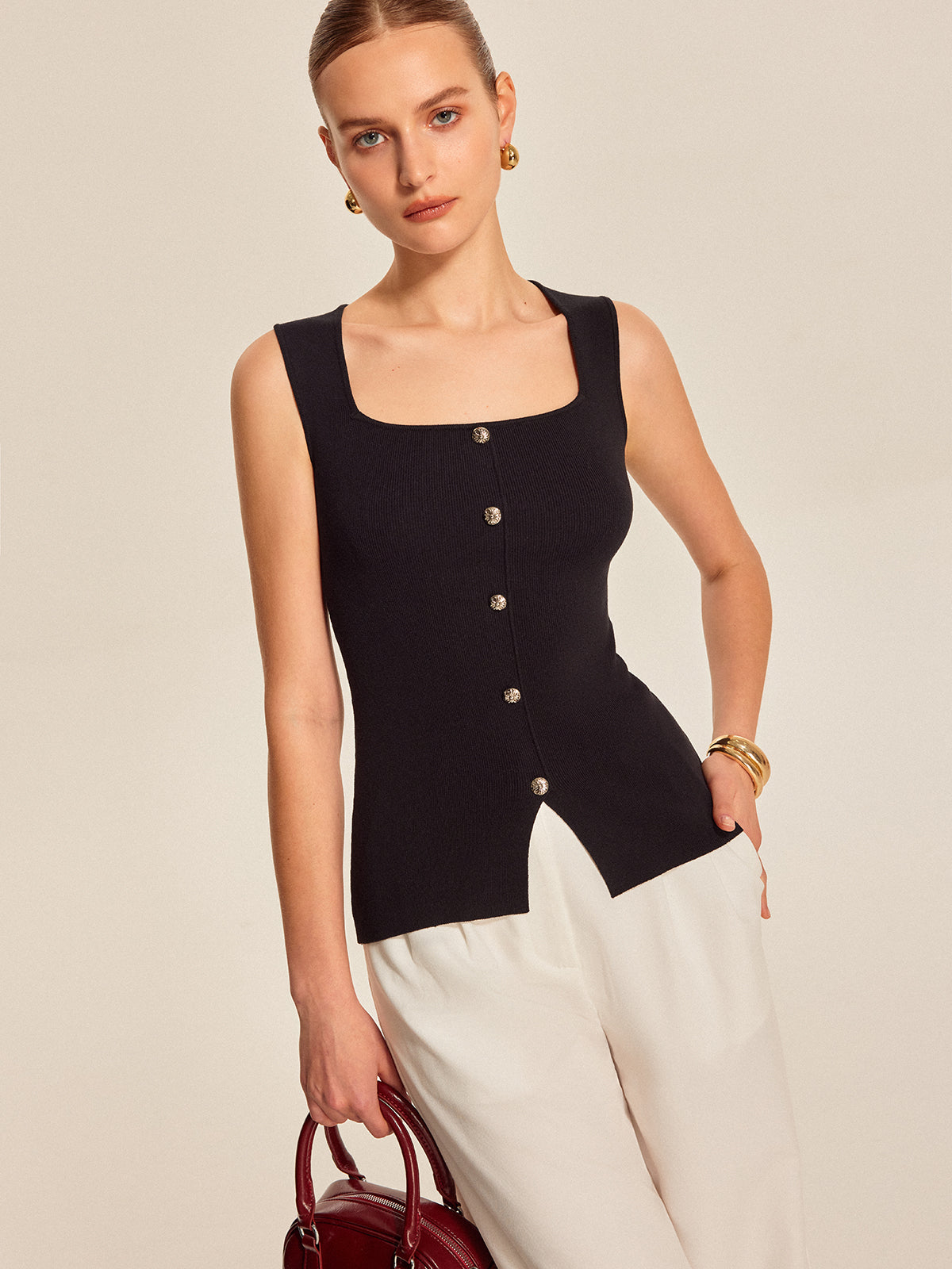 Black ribbed sleeveless top with buttons