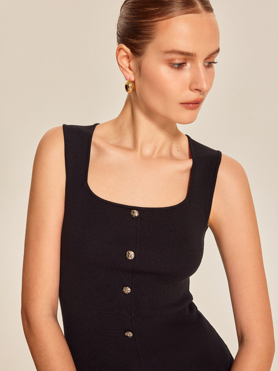 Black ribbed sleeveless top with buttons
