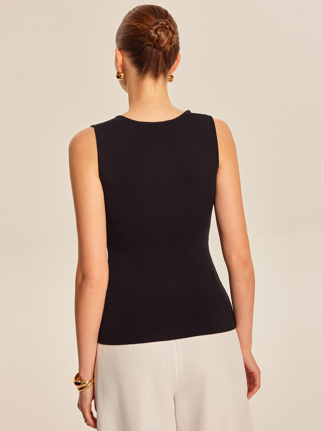 Black ribbed sleeveless top with buttons