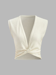 Sleeveless twisted top with structure