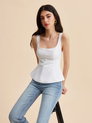 White corset top with structured peplum