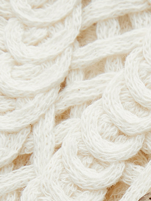 Cream-colored crochet cardigan with floral pattern