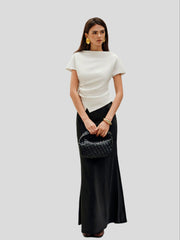 Draped top with asymmetrical hem