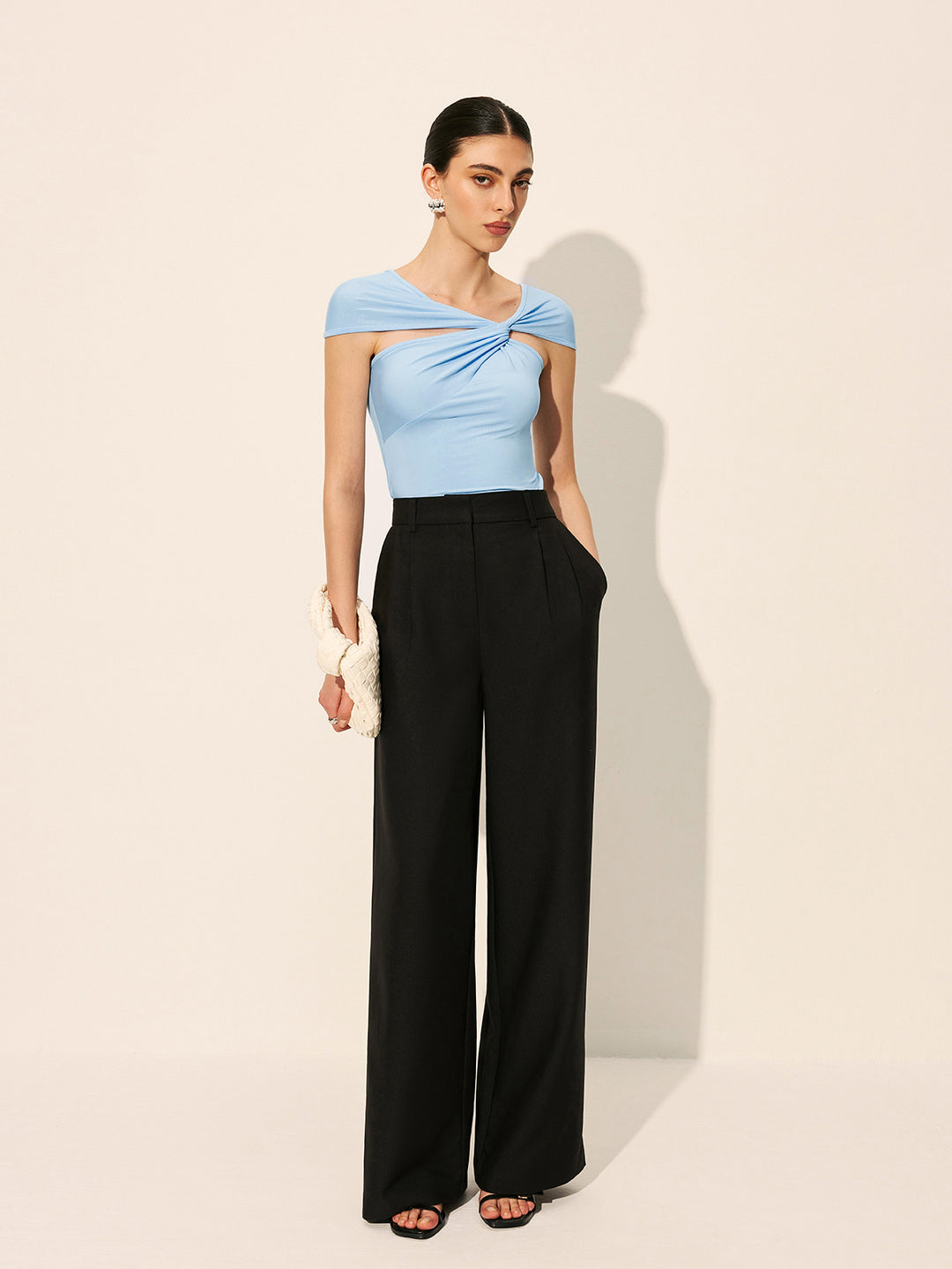 Light blue asymmetrical top with twist detail