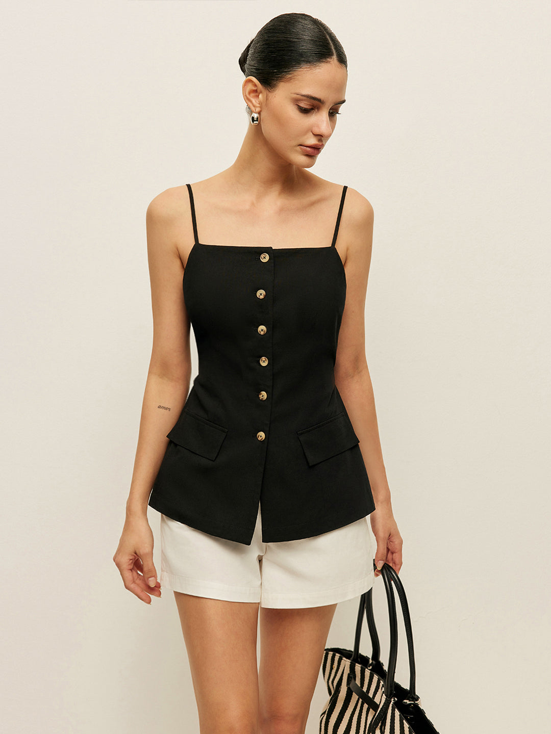 Black tank top with buttons and pocket details