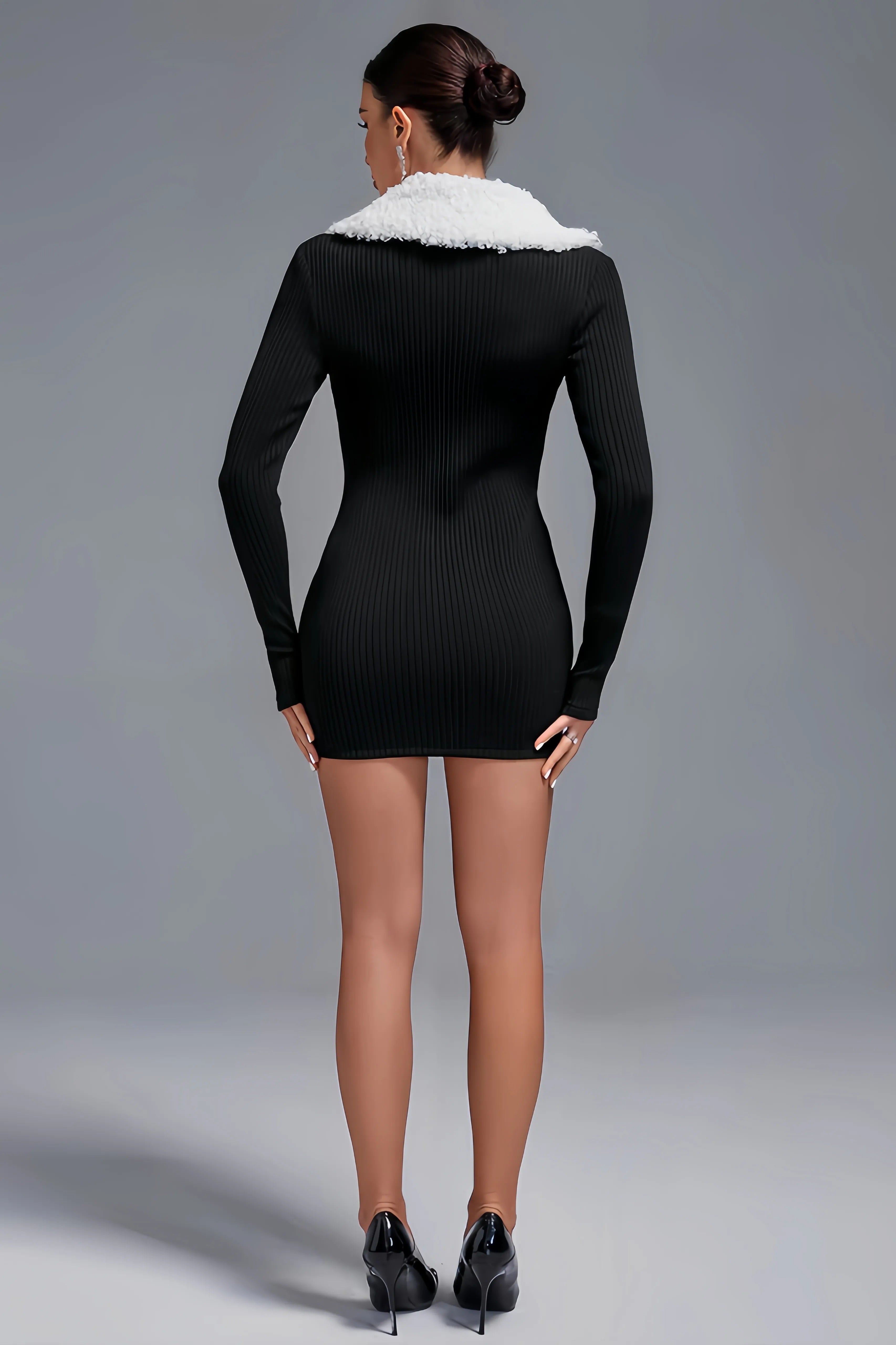 Black ribbed mini dress with white faux fur and zipper