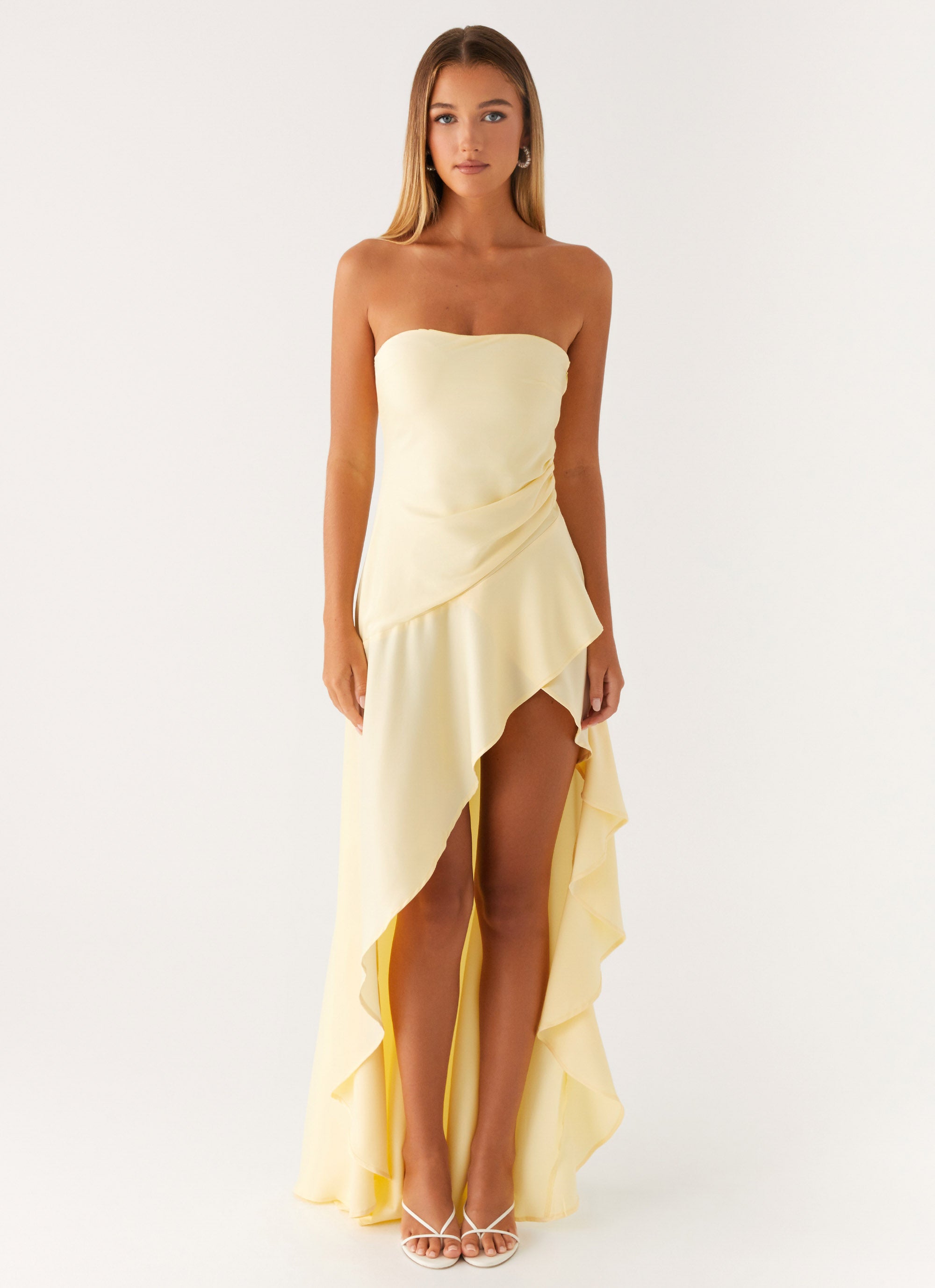 Light yellow strapless long dress with ruffles