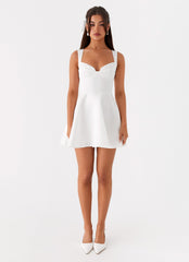 White mini dress with accentuated bust