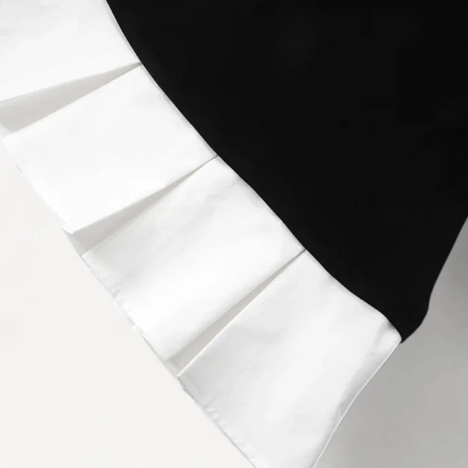 Mini dress with contrasting pleated skirt