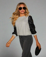 Lädersömmar långärmad rund hals