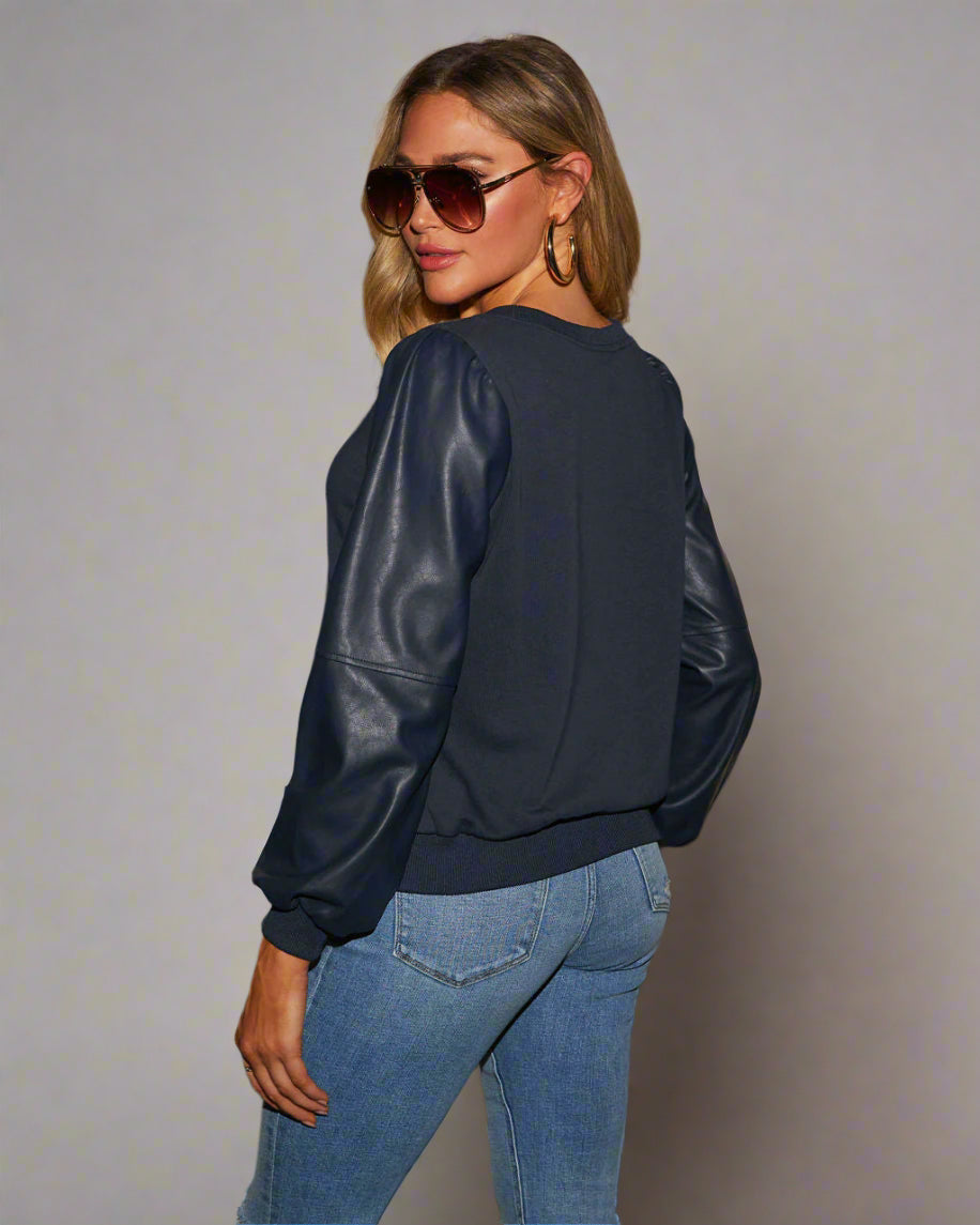 Lädersömmar långärmad rund hals