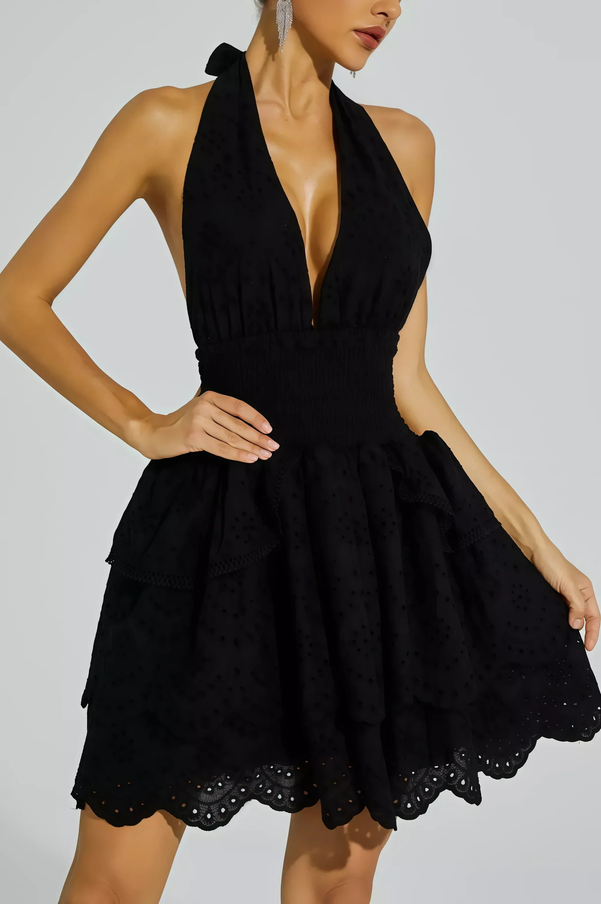 Black backless dress with embroidered ruffled skirt