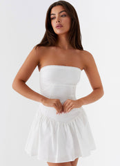 White strapless mini dress with ruffled skirt