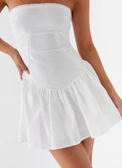 White strapless mini dress with ruffled skirt