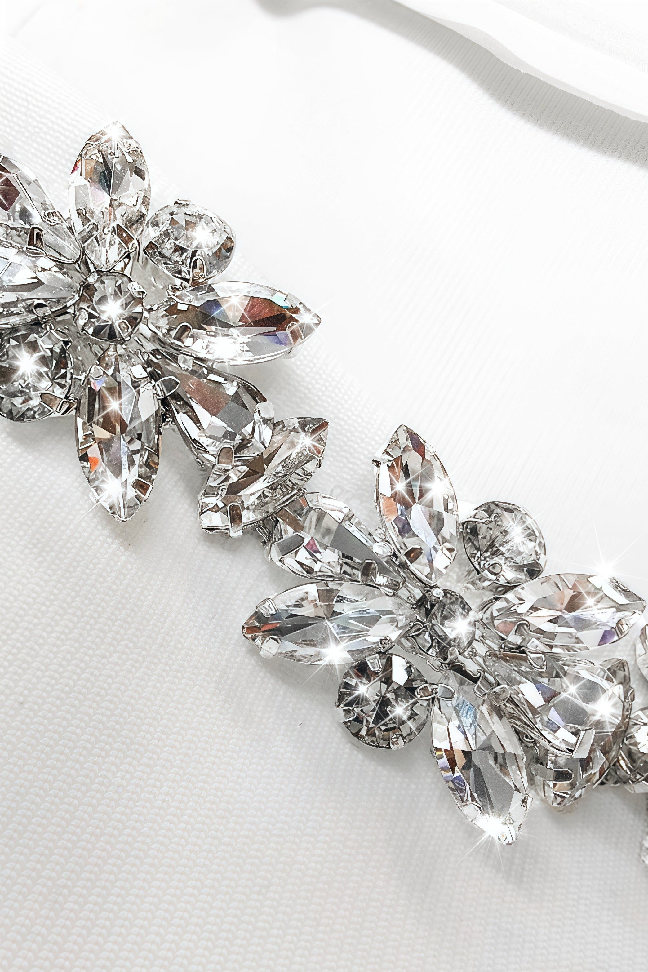 White mini dress with long sleeves and embellished square neckline