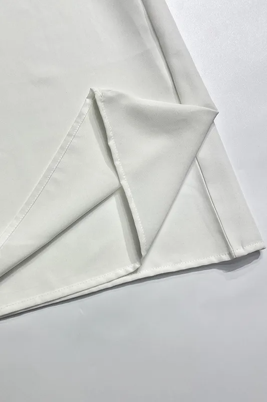 White sleeveless long dress with open back