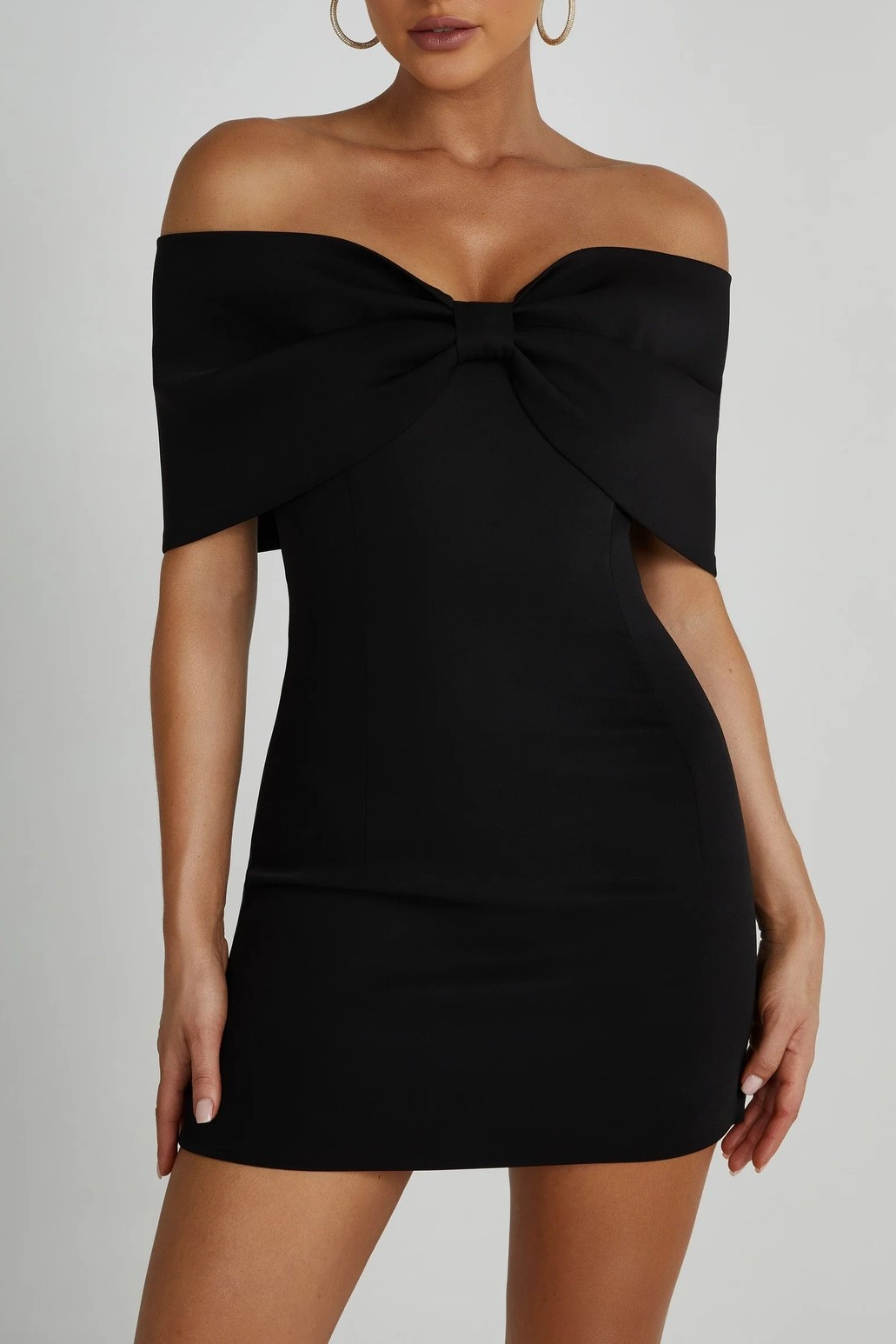 Black off-the-shoulder mini dress with bow detail