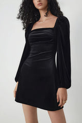Black velvet dress with long puff sleeves