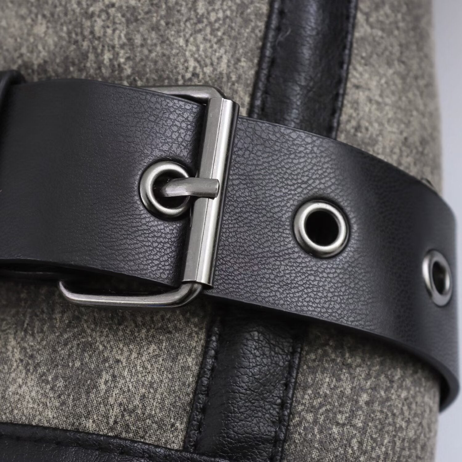 Short jacket with stand-up collar and buckle details