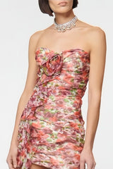 Pink strapless mini dress with pattern and draping