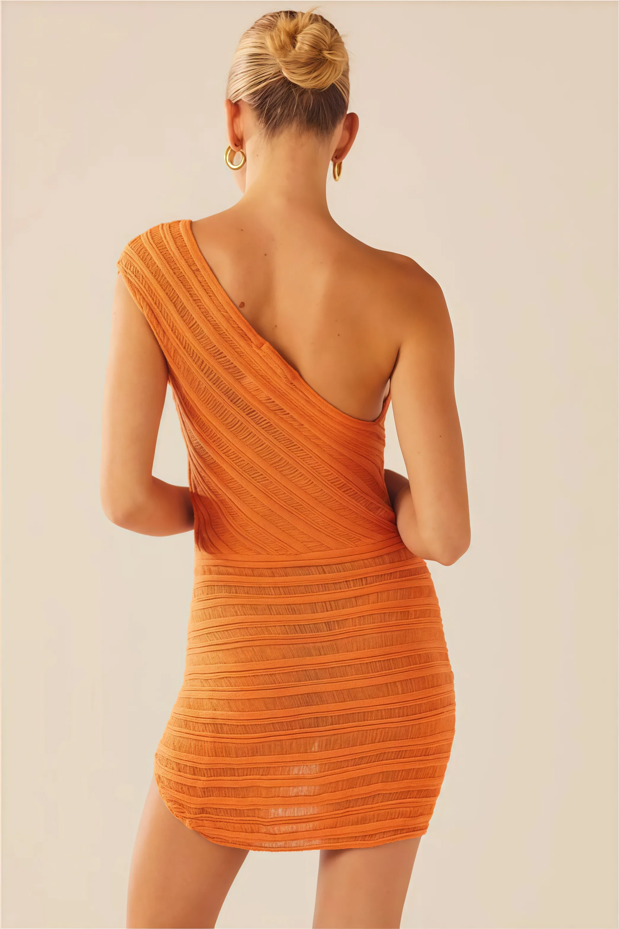 Orange asymmetrical mini dress with textured pattern