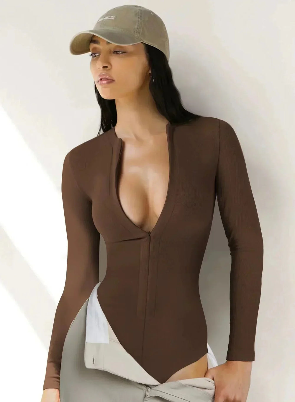 Bodysuit med dragkedja och långa ärmar