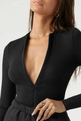 Bodysuit med dragkedja och långa ärmar