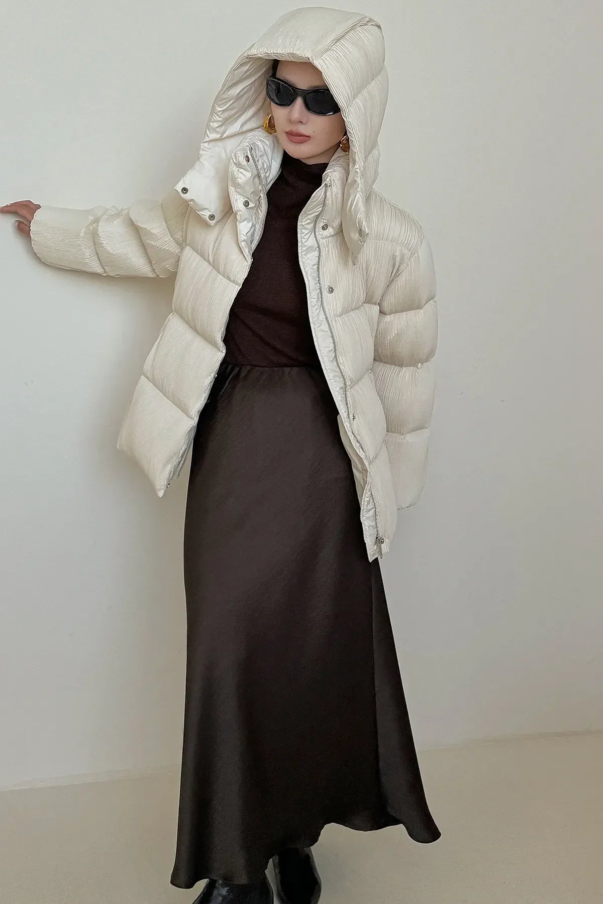 Puffer jacket with waist belt and high stand-up collar