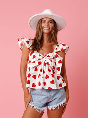 V-ringad topp med rosett och hjärtmönster