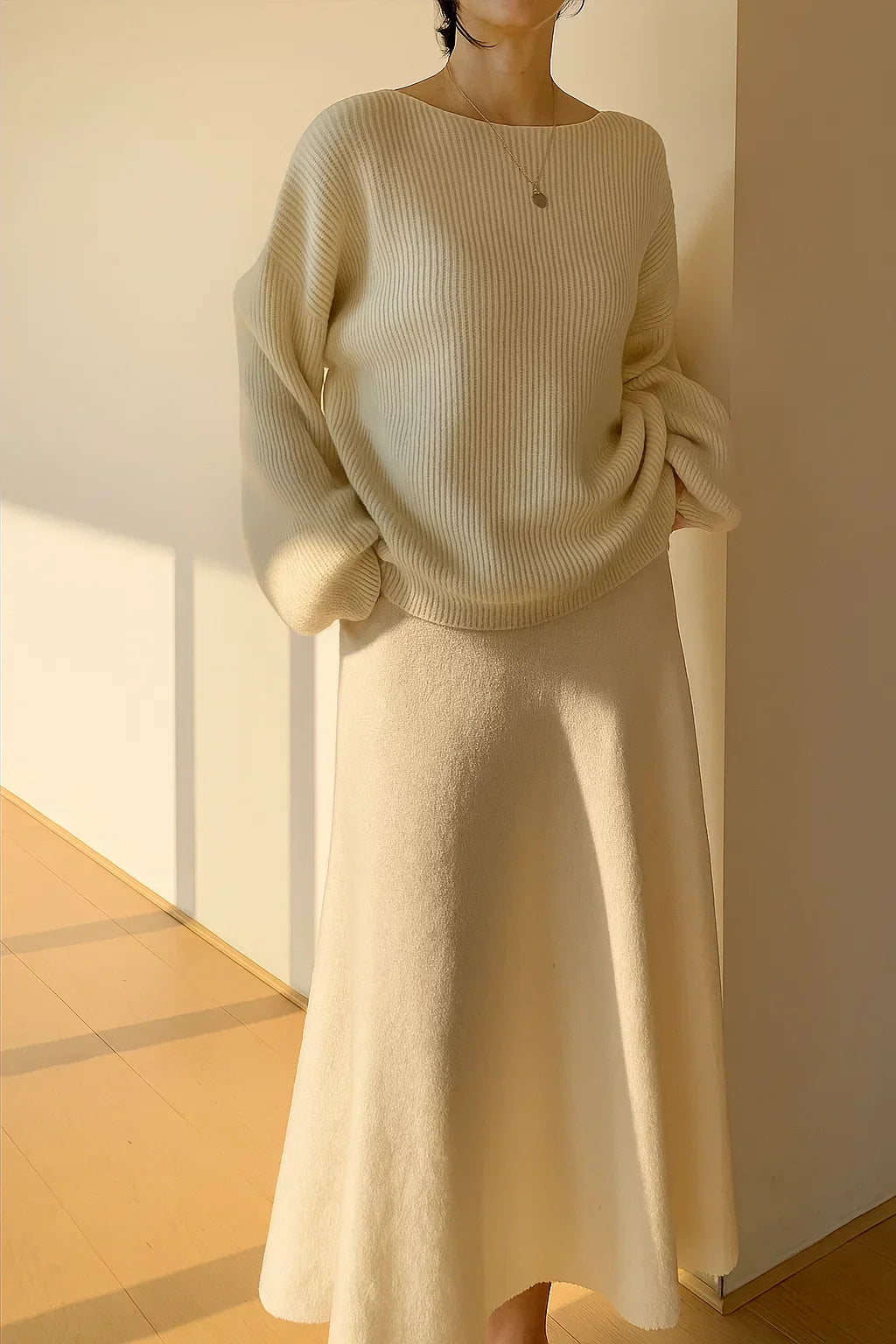 Knitted sweater and flared skirt set with ribbed structure
