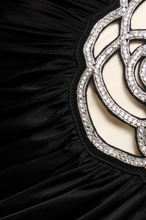 Black asymmetrical mini dress with pink appliqués and straps