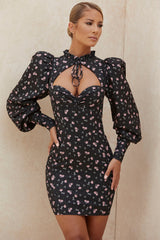 Miniklänning med puffärmar och blommigt tryck