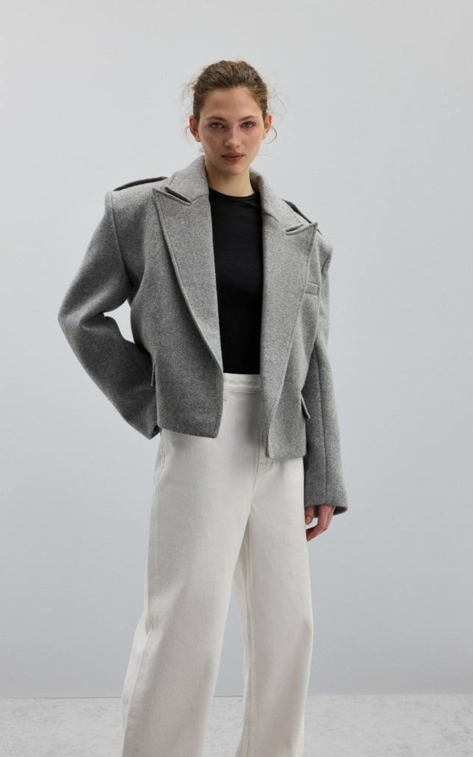 Gray short blazer with wide lapels and epaulettes