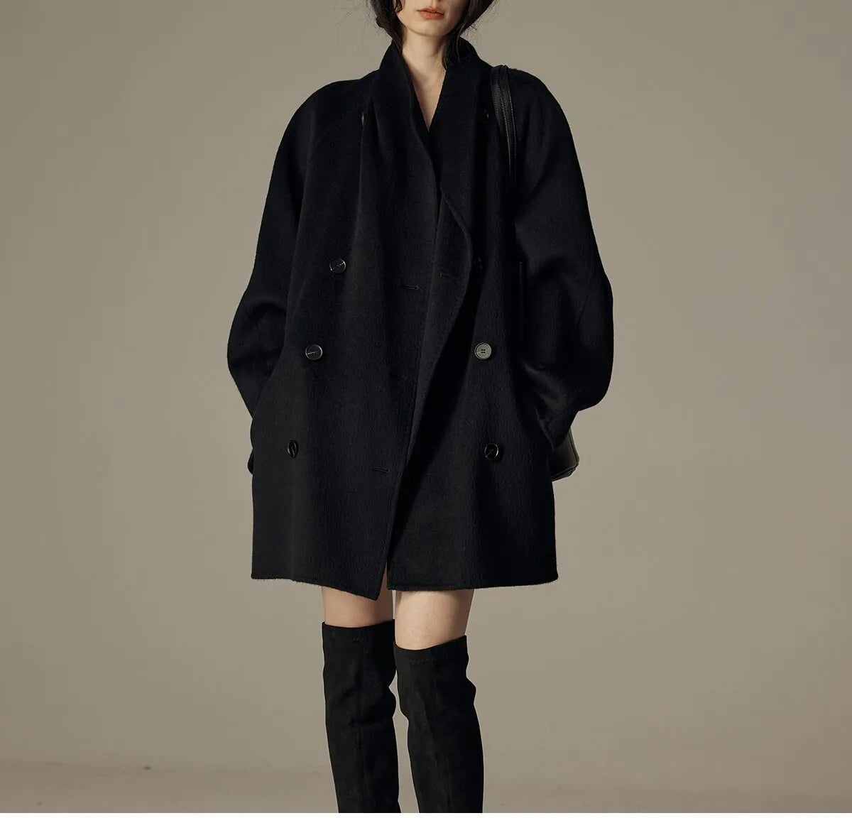 Oversized double-breasted coat with shawl collar.