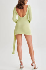Light green mini dress with draped details