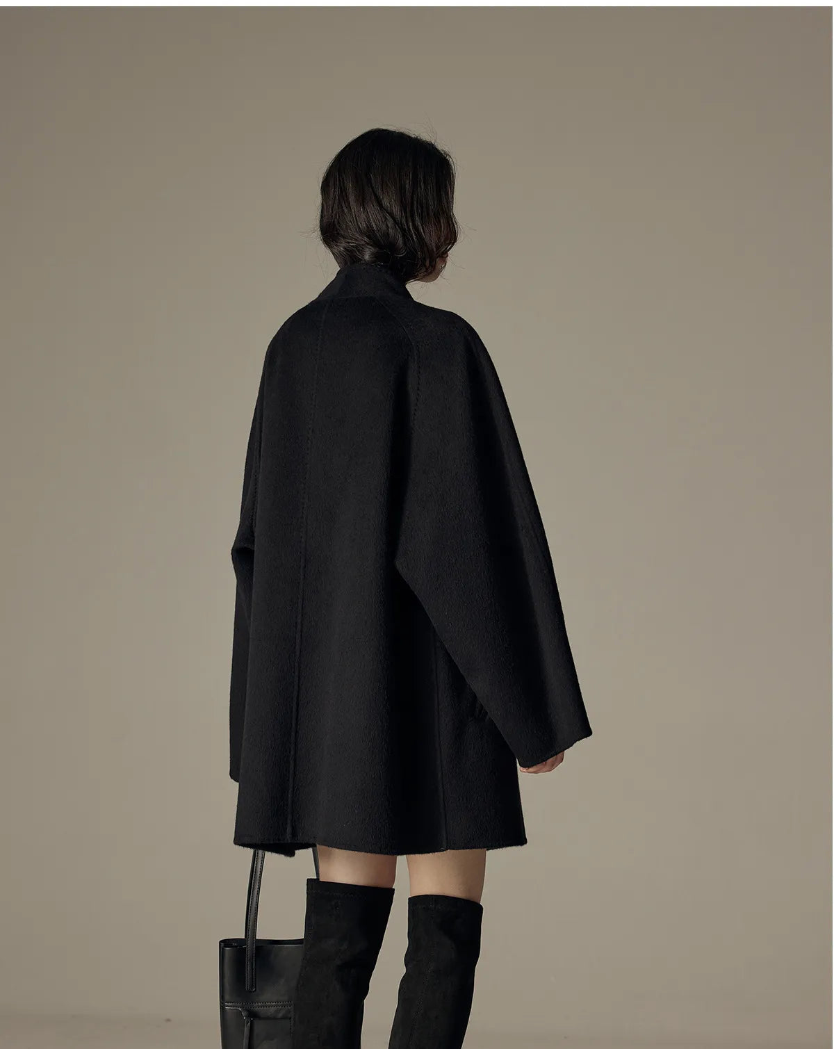 Oversized double-breasted coat with shawl collar.