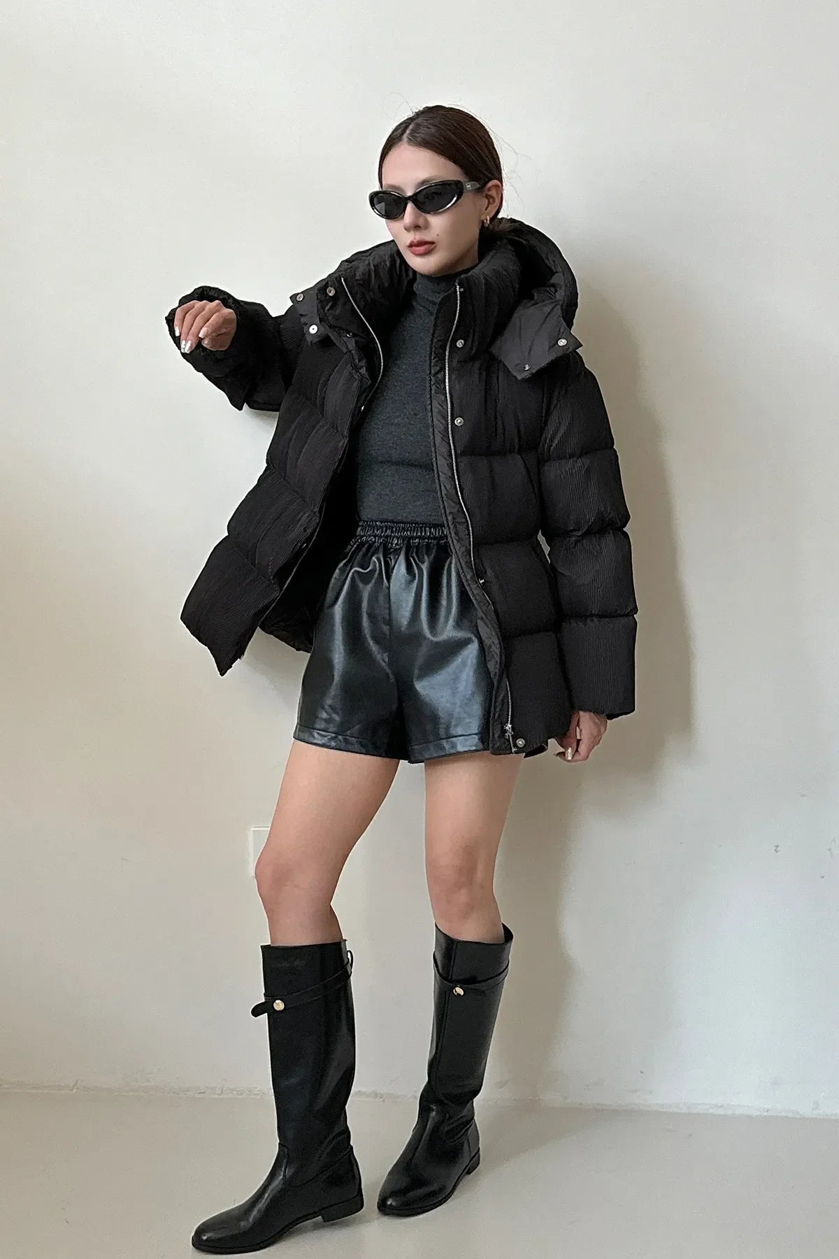 Puffer jacket with waist belt and high stand-up collar